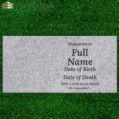 Grey granite flat headstone