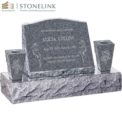 Granite slant headstone with vases